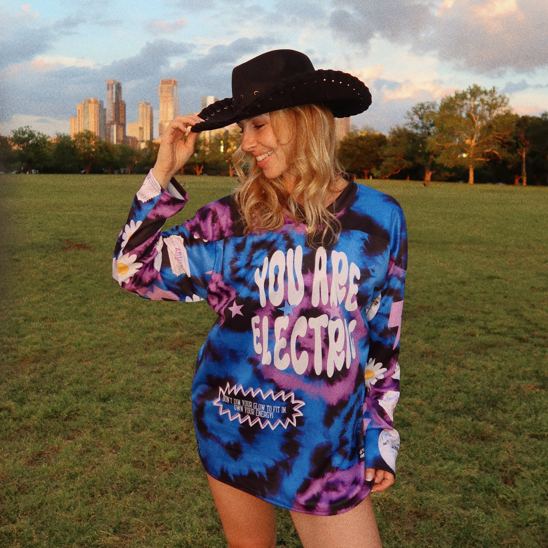 Model wearing blue and purple tie-dye EDM jersey for EDC music festival